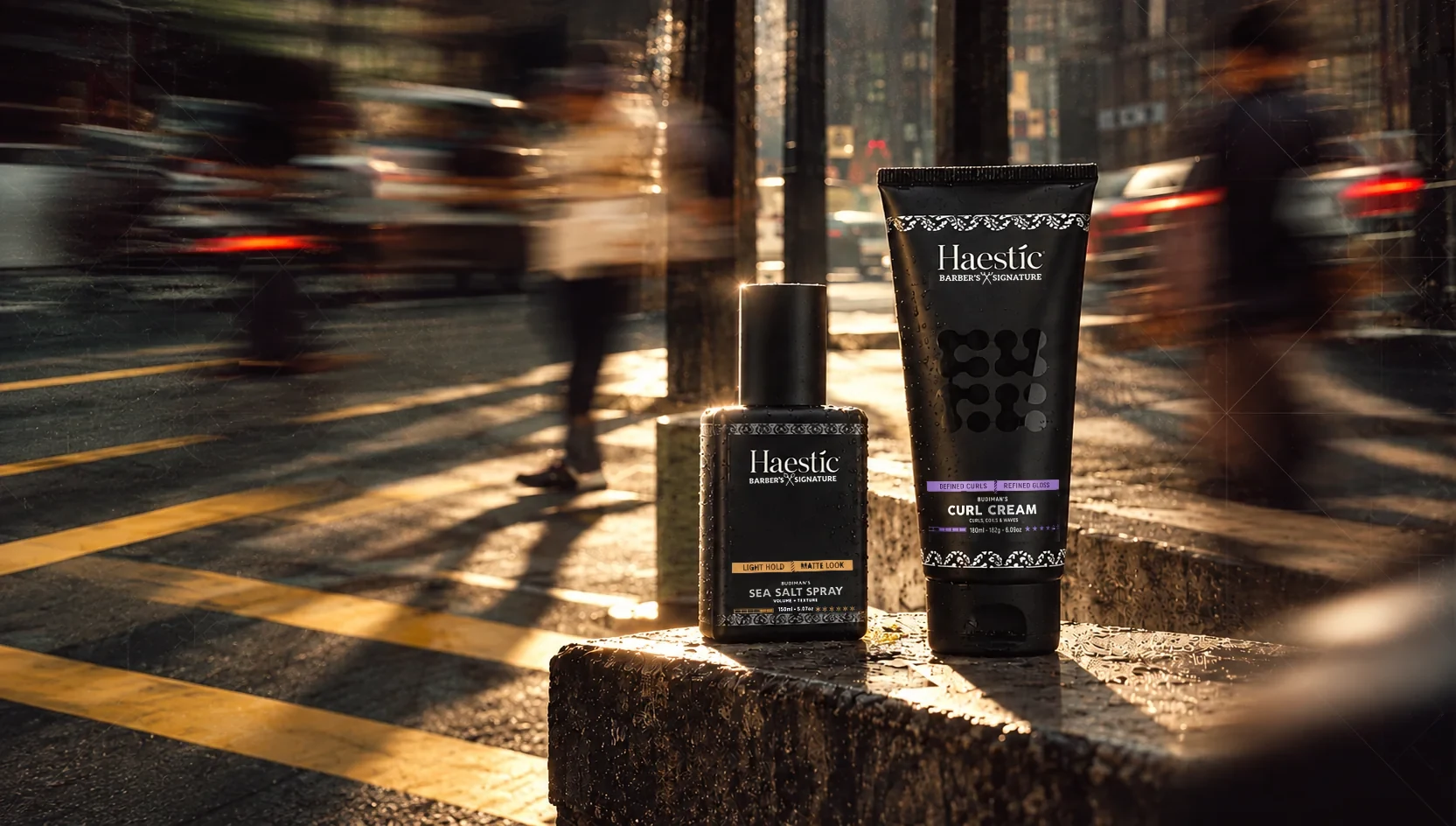 Haestic Sea Salt Spray and Curl Cream on a stone ledge in warm street light